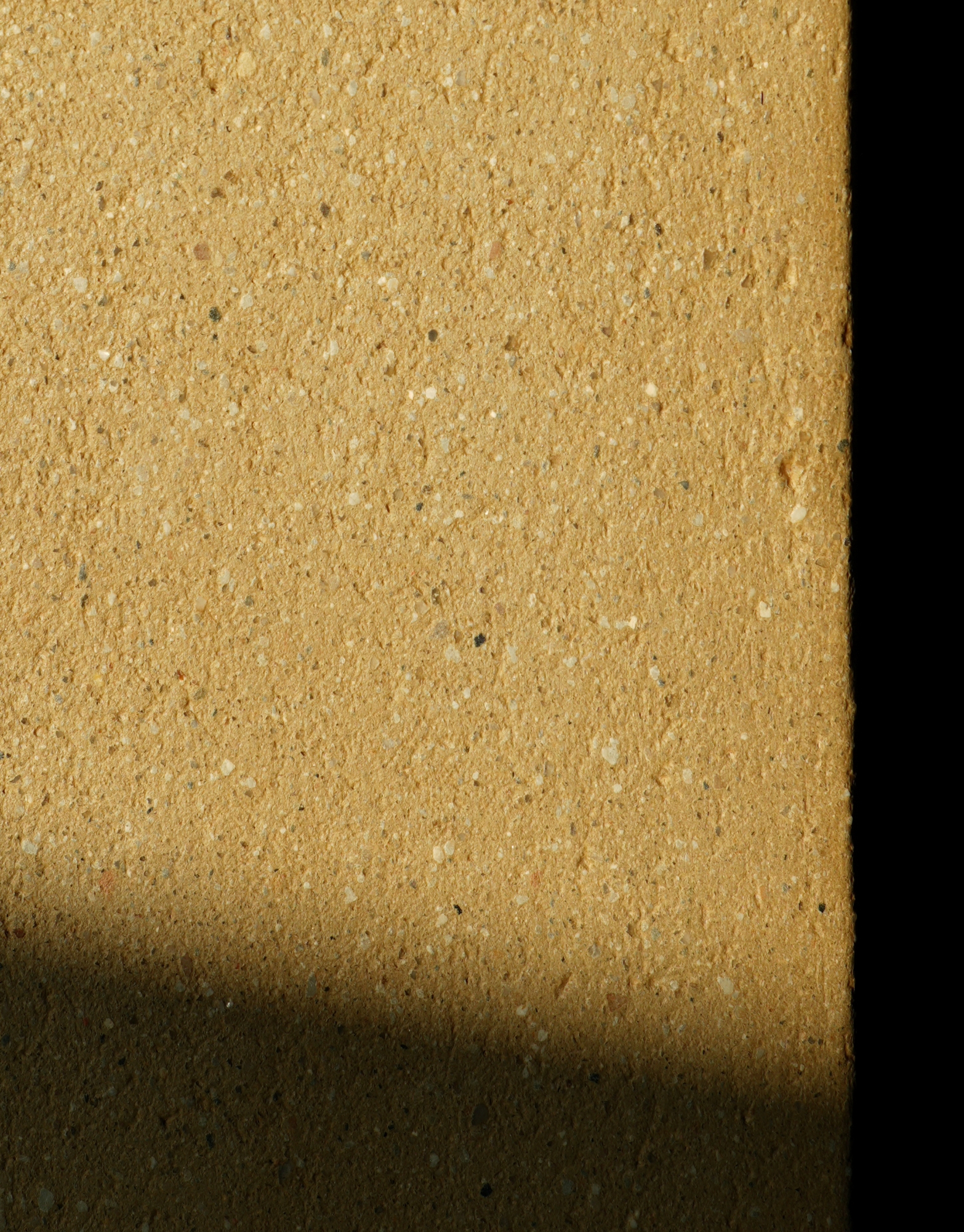 Écla Terre Crue, détails du grain de la terre crue beige moucheté.