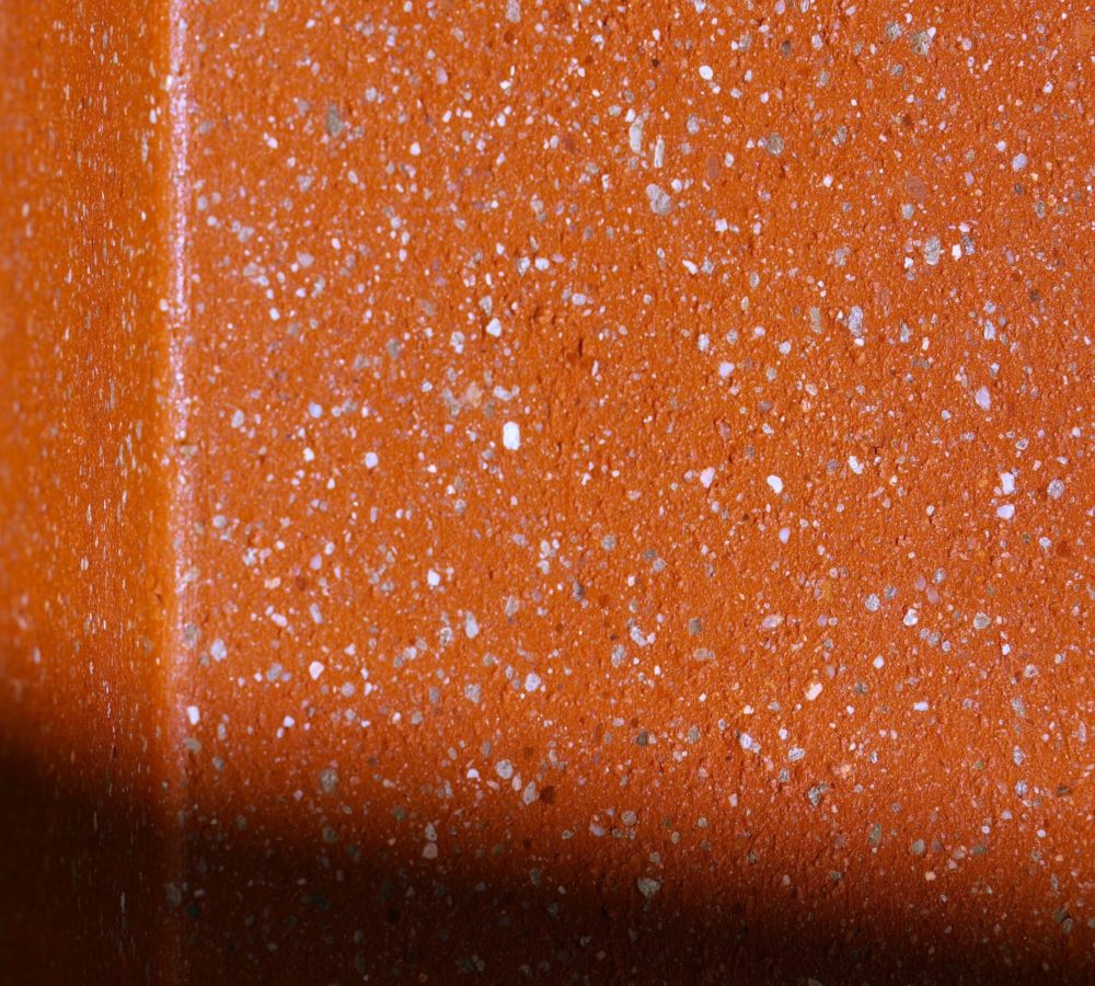 Écla terracotta, détails du grain de la terre cuite rouge moucheté blanc
